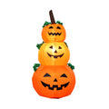 Citrouille gonflable Halloween allumée avec lumière orange chaleureuse, vue de face